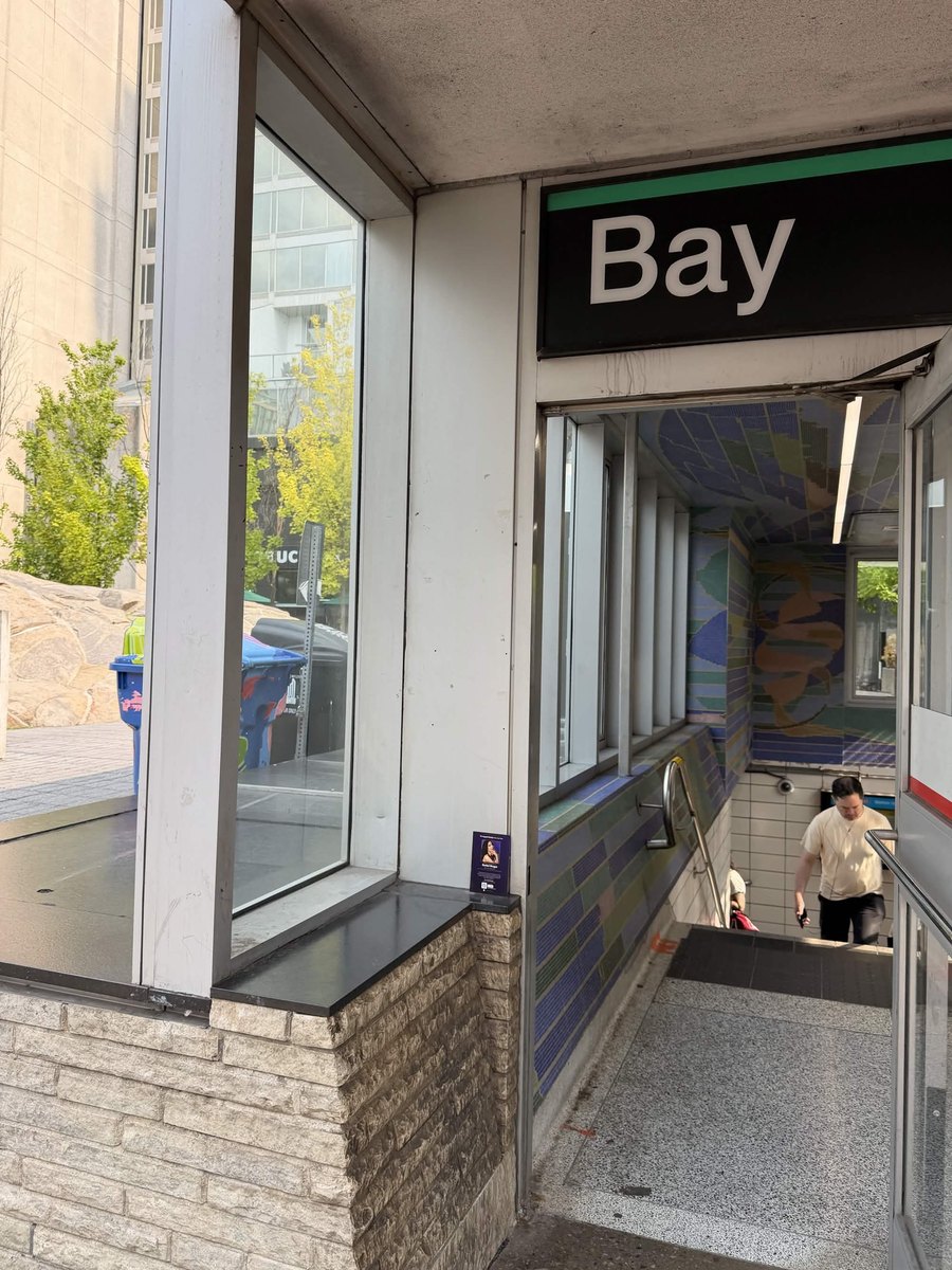 Supporter card at the Bay subway station entrance, Toronto