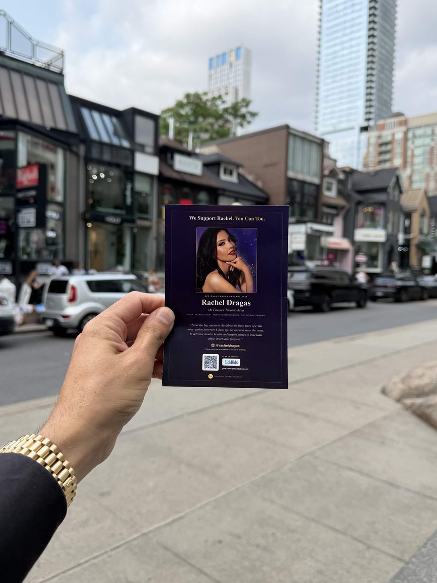 Supporter card held up on a Yorkville street, Toronto