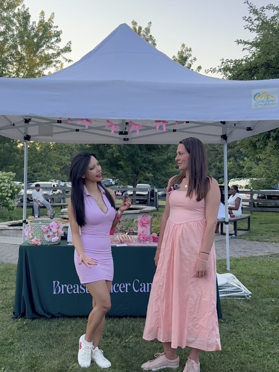 Rachel Dragas interviewing a representative at the Breast Cancer Canada tent, Ros&eacute; Picnic 2026